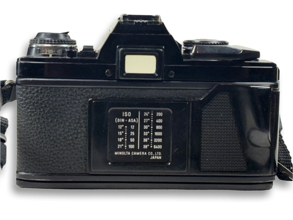 Vintage black camera with visible brand name on a white background